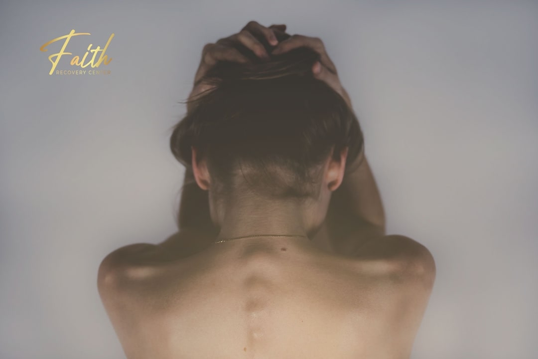 Depressed woman holding her head wondering why doesn't rehab work for some people