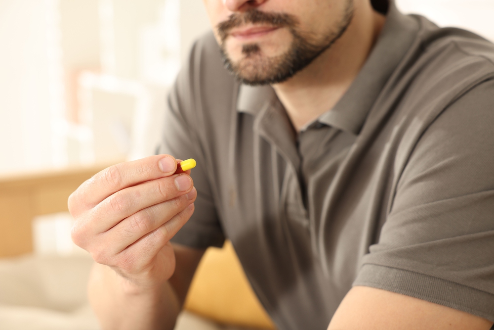 Is lorazepam addictive featured image - Man with a pill on his hand, closeup