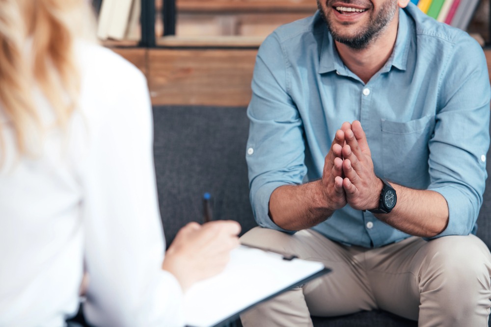 Cropped image of a man undergoing individual drug counseling