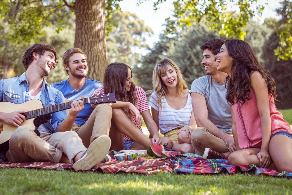 A support group in a park having a picnic, representing supportive cocaine addiction treatment in Beverly Hills.