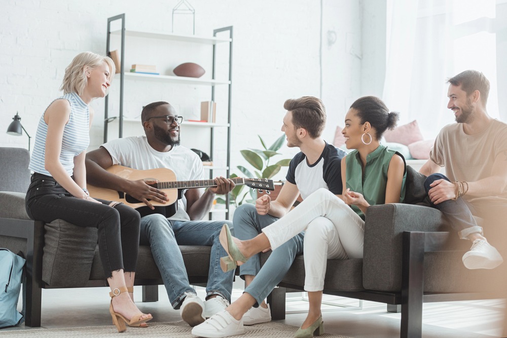Group therapy session at a cocaine rehab center, with people sitting in a circle offering support to one another.